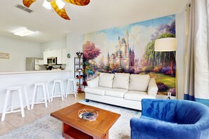 Télévision, table de tennis de table, livres