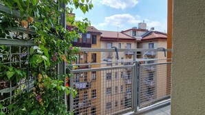 A balcony with a metal railing, overlooking a residential area with multi-story buildings and a clear sky. - Italianway - Palestrina 31 (Milan)