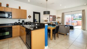 Townhome, Multiple Beds, Hot Tub, Garden View (Enchanted Tiki Cottage) | Private kitchen | Fridge, microwave, oven, stovetop