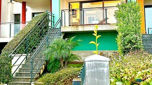 A multi-story building with a staircase leading to a balcony. - Tiffany Home near Cefalù  (san nicola l'arena)