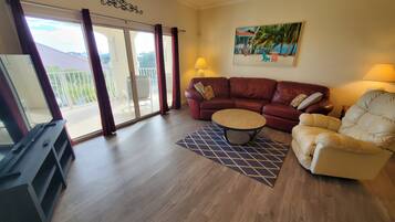 Condo, Multiple Beds, Pool Access, Pool View | Living area | 40-inch flat-screen TV with cable channels, TV