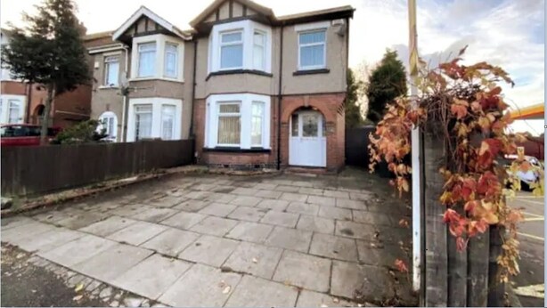A two-story residential building with a front garden and a paved driveway. - Budgeted Shared Residence near Coventry Building Society (CBS) Ricoh Arena & M6 (Coventry)