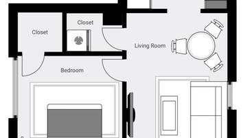 A floor plan with a bedroom, closet, living room, kitchen, bathroom, and vestibule.
