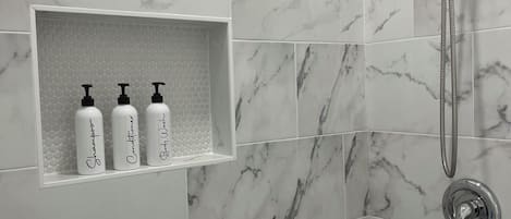 Shower, hair dryer, towels, soap