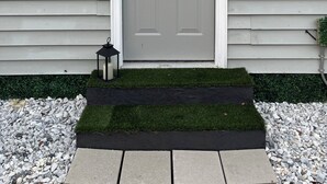 A grey front door with a small step leading up to it, a mailbox, and a wall-mounted light fixture. - Cozy Private Entire Studio Suite Independent Guest Entrance (Jacksonville)