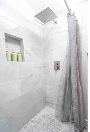 Shower, hair dryer, towels, soap