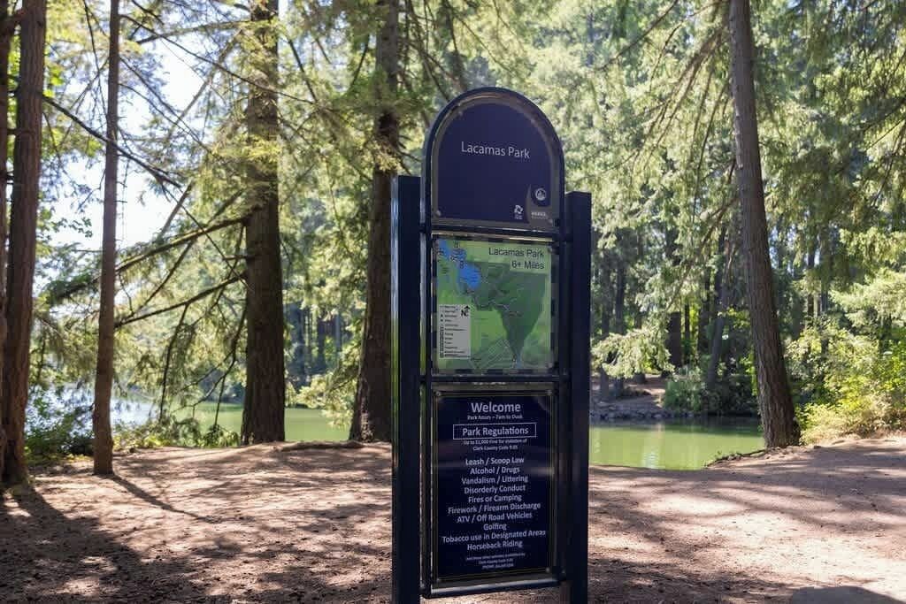 A signboard at Lacamas Park with park regulations and a map.