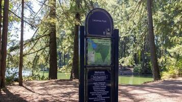 A signboard at Lacamas Park with park regulations and a map.