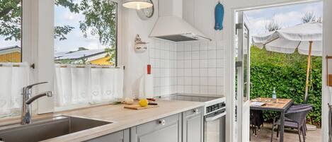 Fridge, stovetop, dishwasher, coffee/tea maker