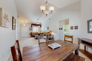Enjoy meals with family and friends in this elegant dining area, complete with a large table and comfortable seating.