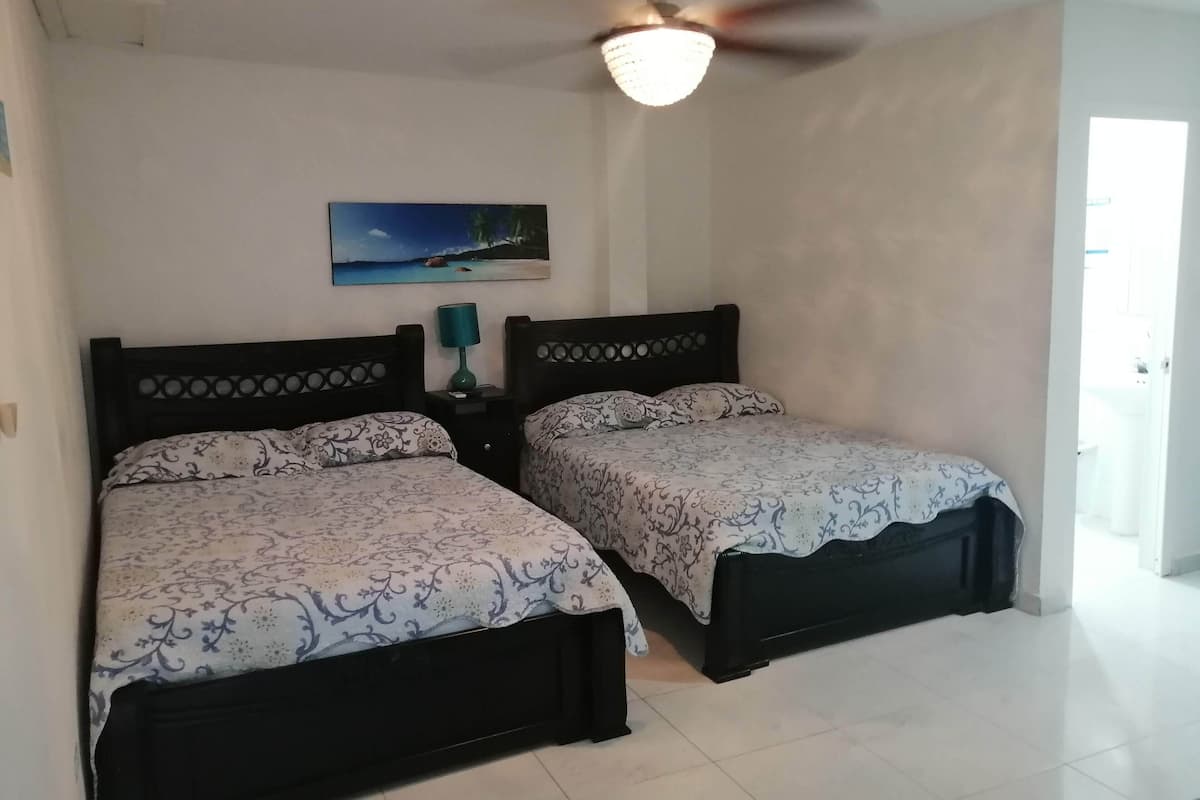 Superior Room, 2 Queen Beds, Courtyard View | 1 bedroom, down comforters, free WiFi