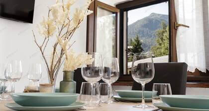 Bright apartment in the town center with ski storage and communal parking.