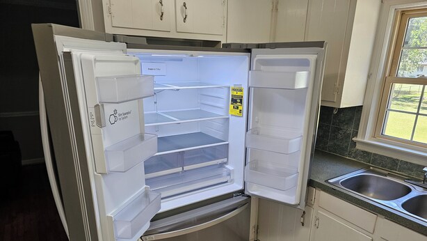 A stainless steel refrigerator with multiple compartments and a fresh air filter label. - Gorgeous model single family home, fully renovated and ready for you.  (Newport News)