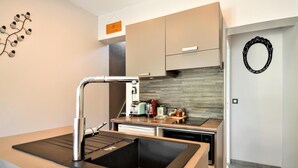 A modern kitchen with a stainless steel sink, a toaster, and a coffee maker. - Stunning home in Beaucaire (Beaucaire)