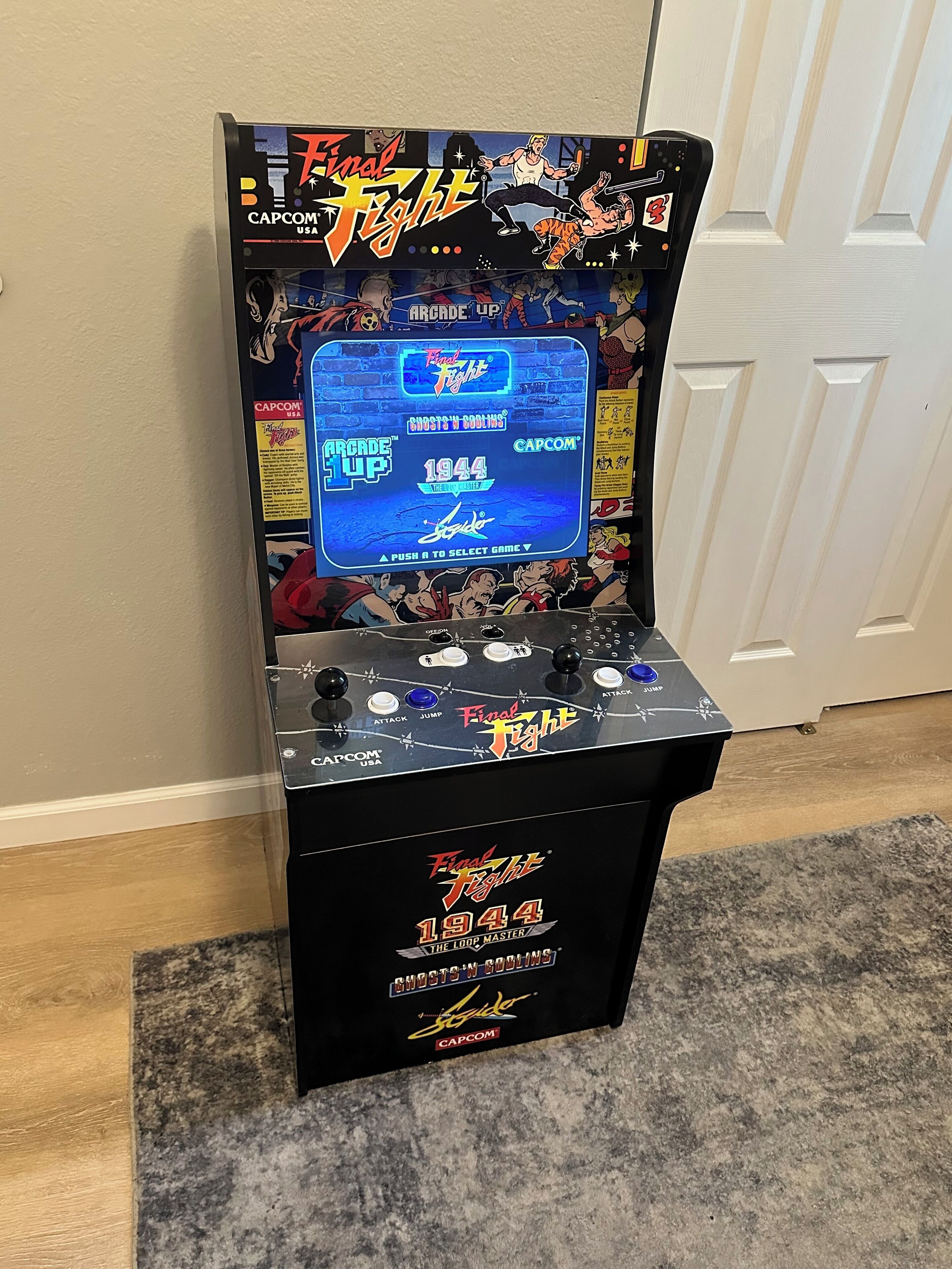 A vintage arcade machine, Final Fight 1944, with a joystick and buttons labeled 'ATTACK', 'JUMP', and 'ATTACK'.