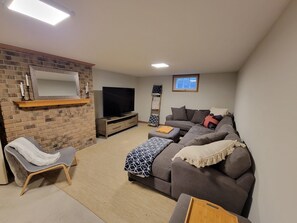 Smart TV, fireplace, table football, books