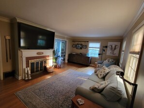 Smart TV, fireplace, table football, books