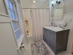 Shower, hair dryer, towels, soap
