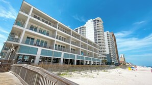 A multi-story hotel with balconies and a beach view. - BEACHFRONT PROPERTY, OUTDOOR POOL, GREAT LOCATION! (Gulf Shores)