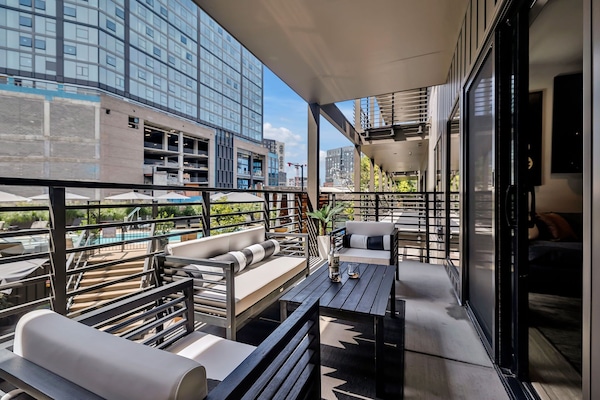 Private patio with comfortable seating overlooking the pool/courtyard, enjoy meals and drinks outside