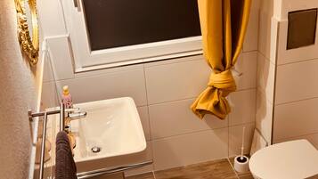 Bathtub, hair dryer, towels