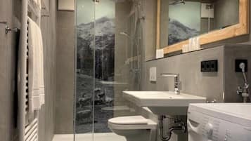 Bathtub, hair dryer, towels