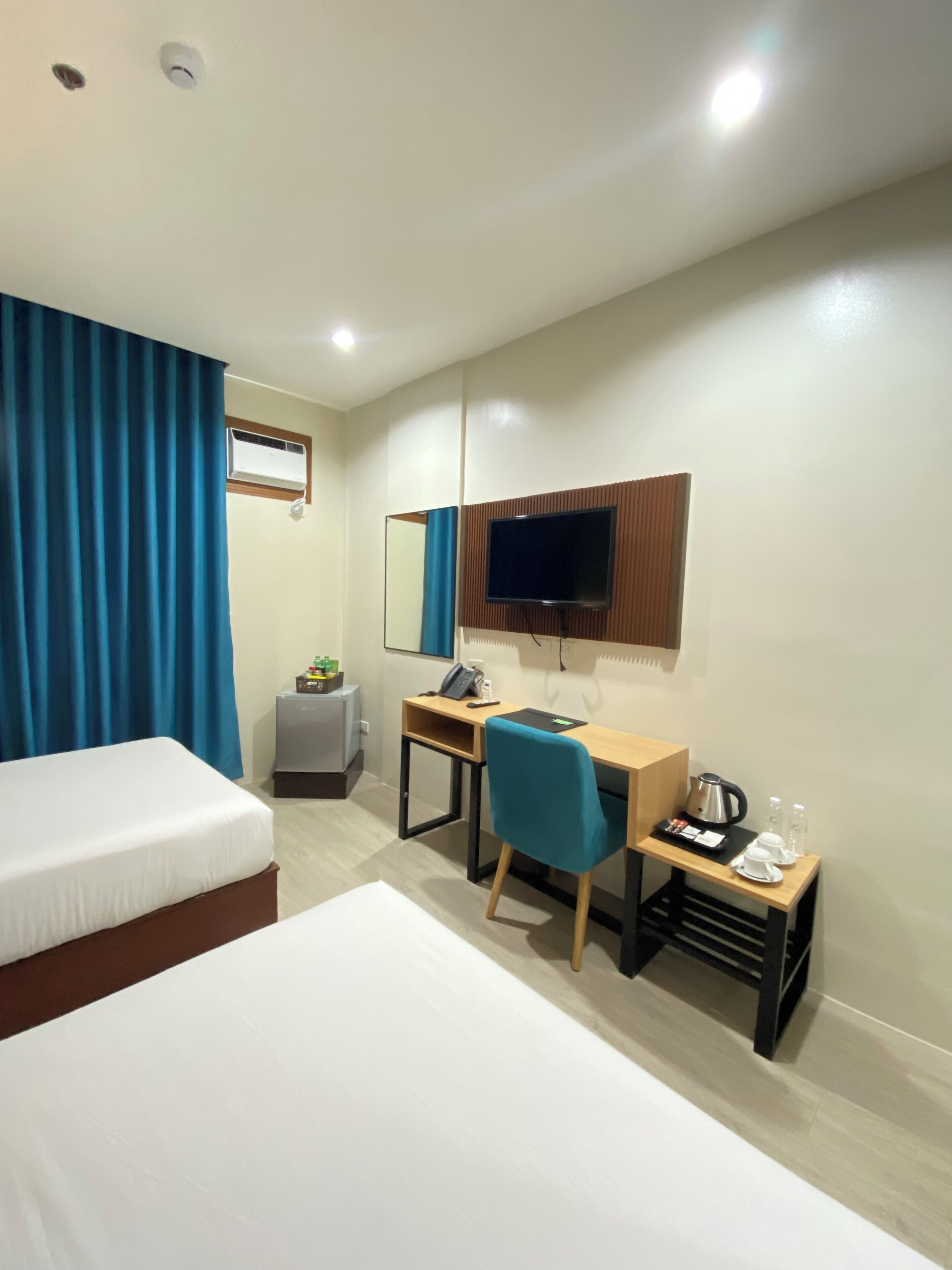 deluxe room | individually furnished, desk, laptop workspace, soundproofing
