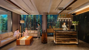 A modern living room with a sofa, coffee table, and decorative items. - Ten Six Hundred, Chao Phraya, Bangkok by Preference, managed by The Ascott Limited (Bangkok)
