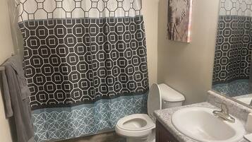 Shower, hair dryer, towels, soap