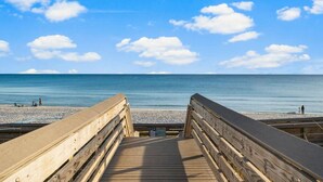 A wooden boardwalk leading to a beach with clear skies and calm waters. - Santa Rosa Beach|Heated Pool|Pet Friendly|Hot Tub|Boat Parking (Santa Rosa Beach)