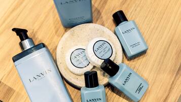 A collection of Lanvin Paris skincare products arranged on a wooden surface.