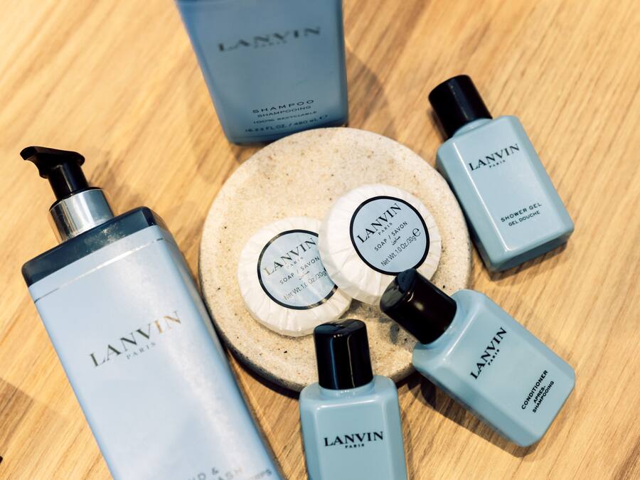 A collection of Lanvin Paris skincare products arranged on a wooden surface.