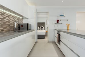 Comfort Apartment | Private kitchen | Fridge, microwave, oven, stovetop