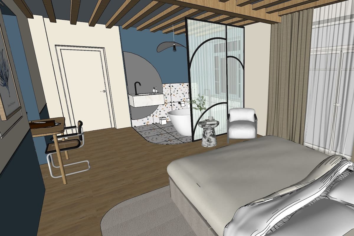 Un dormitorio moderno con una cama grande, un escritorio, una silla y un baño visible a través de una puerta abierta.