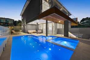 A modern house with a swimming pool, a covered patio, and a view of the surrounding area. - Casa Lux Aireys Inlet Retreat with Heated Pool Spa (Aireys Inlet)