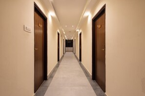 A hotel corridor with doors numbered 109 and 101, leading to rooms.