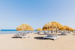 Private beach, free beach shuttle, sun loungers, beach umbrellas