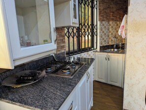 Panoramic Studio Suite, Non Smoking, Lake View | Private kitchen - Oslo Gardens (Entebbe)