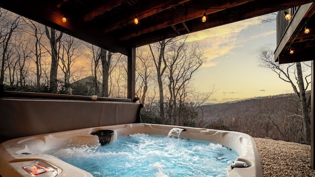 A hot tub with a view of a forested landscape. - Stunning Views, Hot Tub, Impeccable Design (Wintergreen Resort)