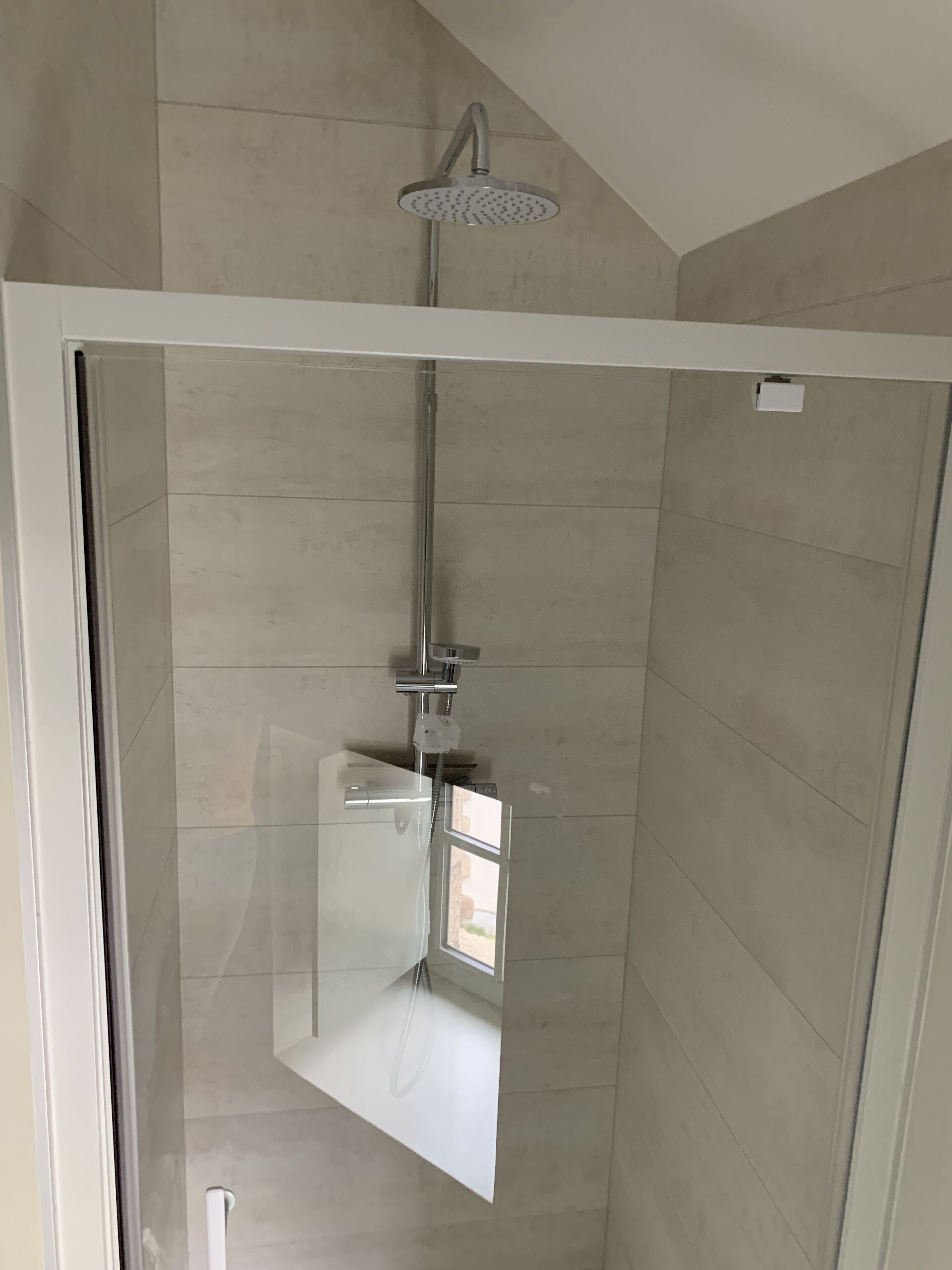 Shower, hair dryer, towels, toilet paper