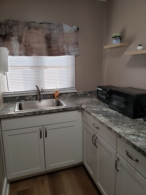 Fridge, microwave, coffee/tea maker, toaster