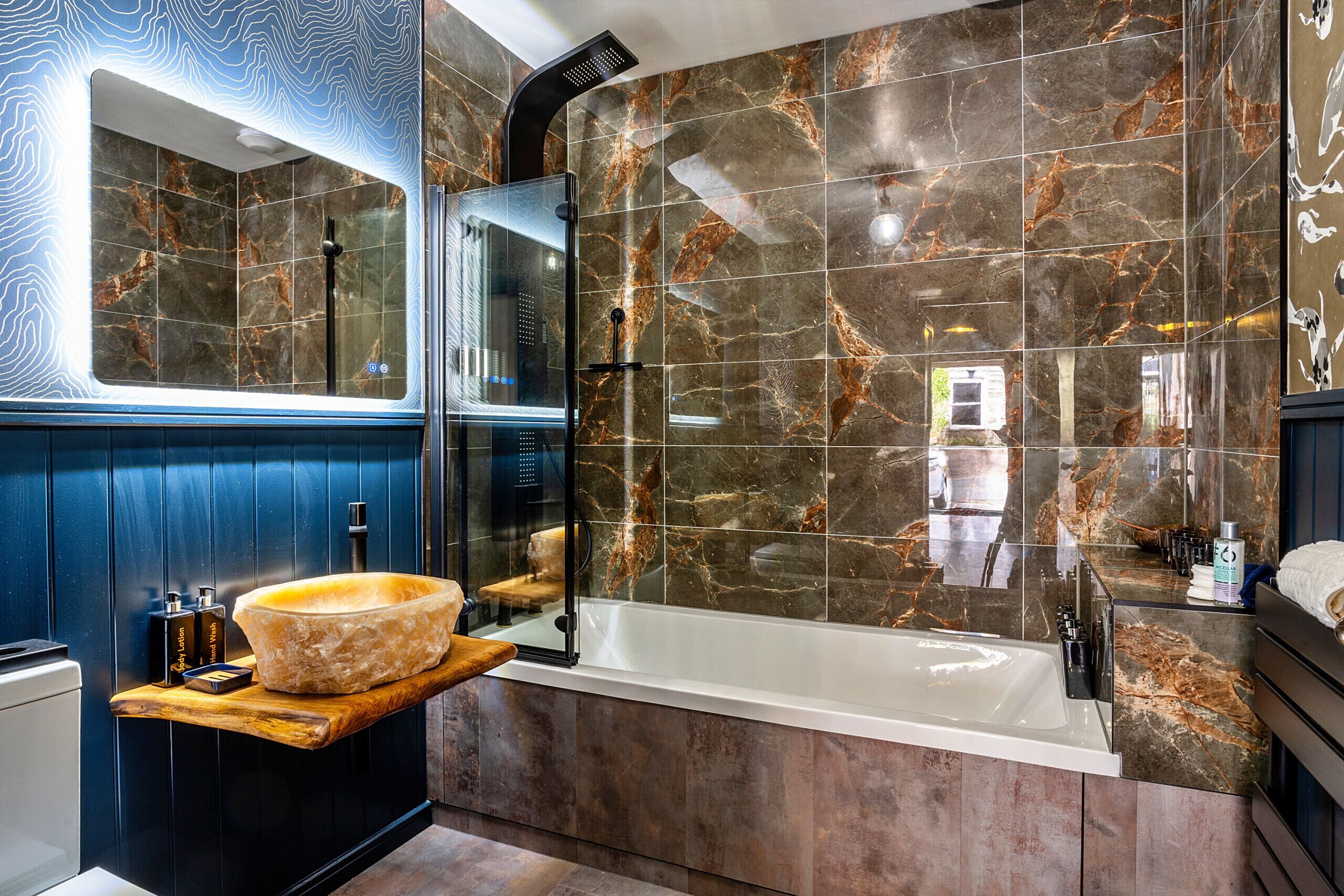 Bathtub, hair dryer, towels, soap