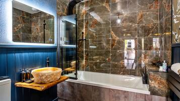 Bathtub, hair dryer, towels, soap