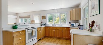 Lakefront home with large yard, screened porch & amazing views