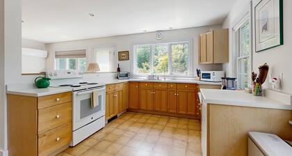 Lakefront home with large yard, screened porch & amazing views