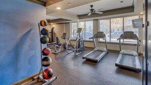 A gym with treadmills, elliptical machines, and a wall-mounted medicine ball rack. - Cozy 1Br Near Downtown + Free Parking + Wifi+ Pool (Nashville)