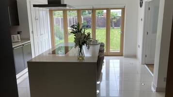 House, Multiple Beds | Private kitchen | Fridge, microwave, oven, stovetop