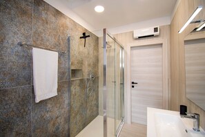 Shower, free toiletries, hair dryer, towels