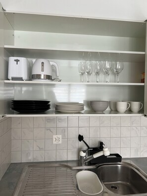 Fridge, microwave, stovetop, coffee/tea maker