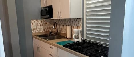 Fridge, microwave, stovetop, coffee/tea maker